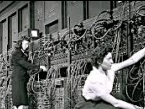 Women working at a computer switchboard