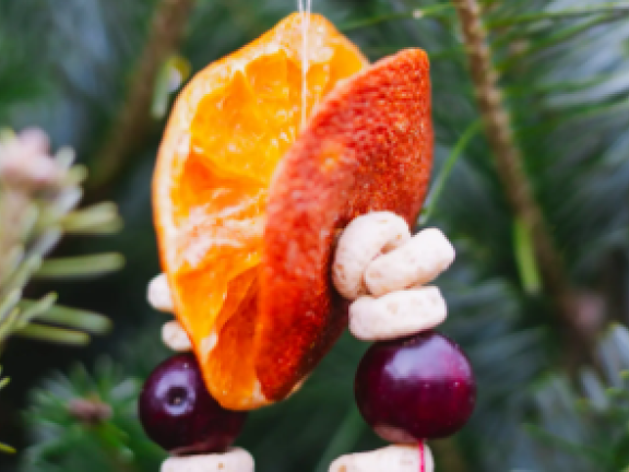Closeup of a tree ornament made of orange and other materials