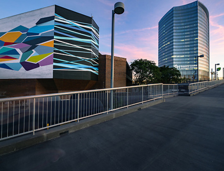 image of the Convergence mural as seen from the South Street Ramp at sunset