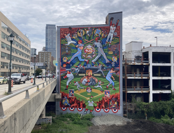Phillies mural alongside the Walnut Street bridge depicting multiple players and the Phanatic 